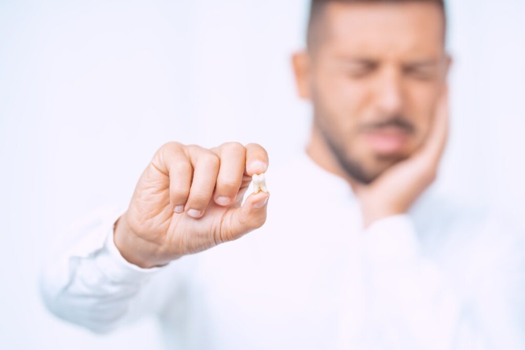 Oral surgeon consulting with a patient about wisdom tooth extraction