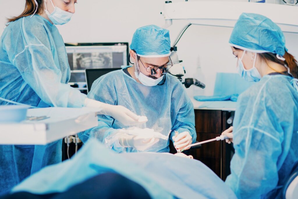 Oral surgery team performing wisdom teeth removal under IV sedation in West Los Angeles
